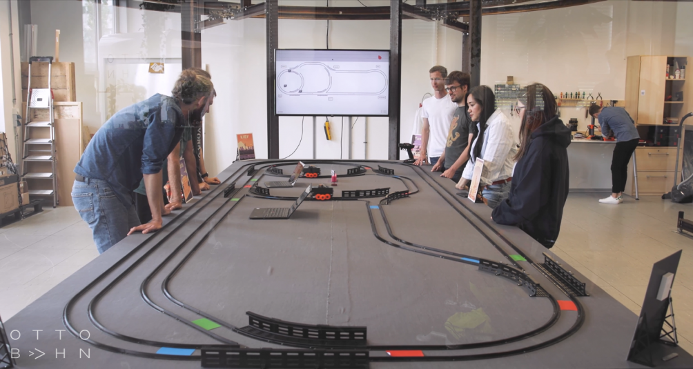 Team of people looking at a test track for skyway