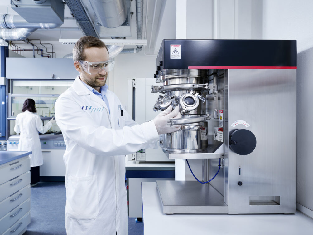 Man in lab coat with equipment